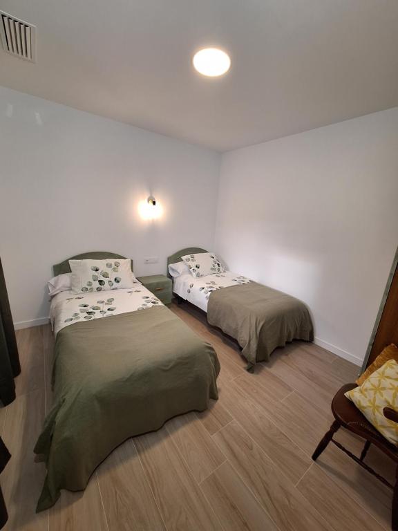 Łóżko lub łóżka w pokoju w obiekcie Casas Rurales Los Marqueses