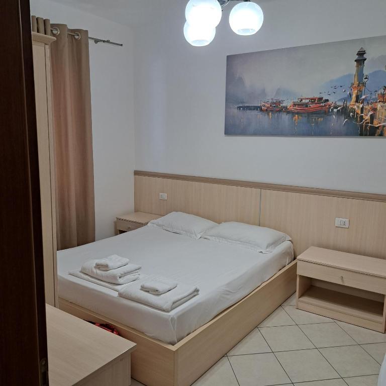 Postel nebo postele na pokoji v ubytování Apart-Hotel Alvi