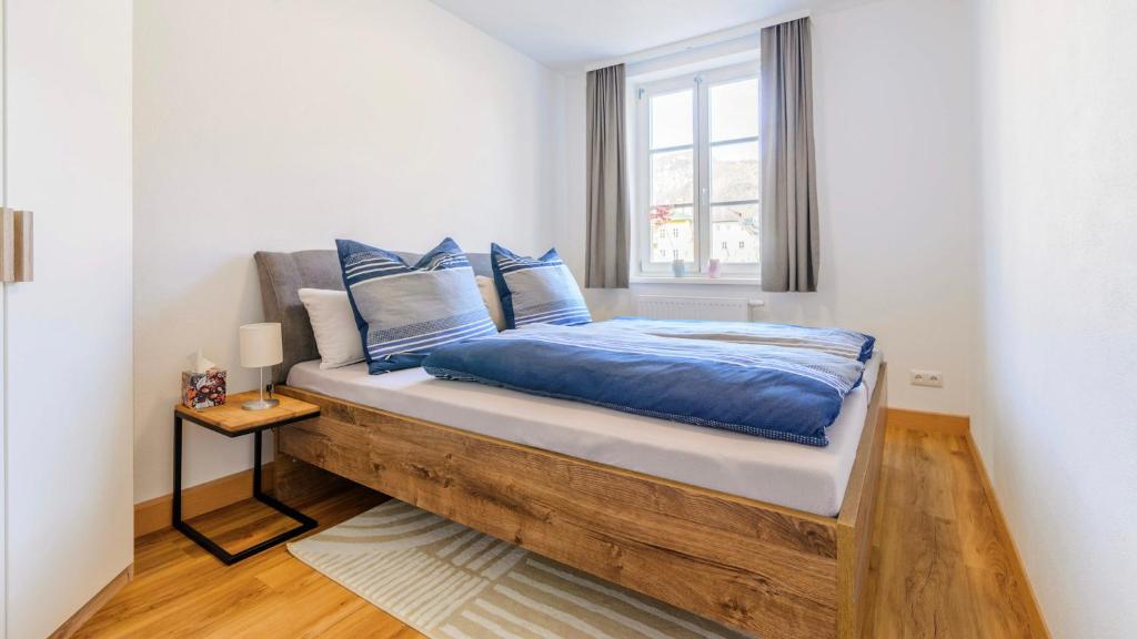 Postel nebo postele na pokoji v ubytování Traunkai Apartments Bad Ischl