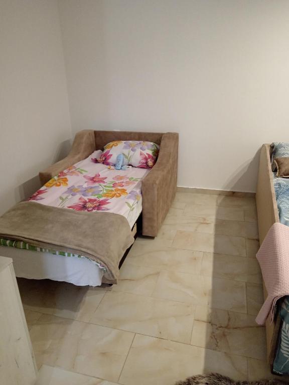 Postel nebo postele na pokoji v ubytování Tića