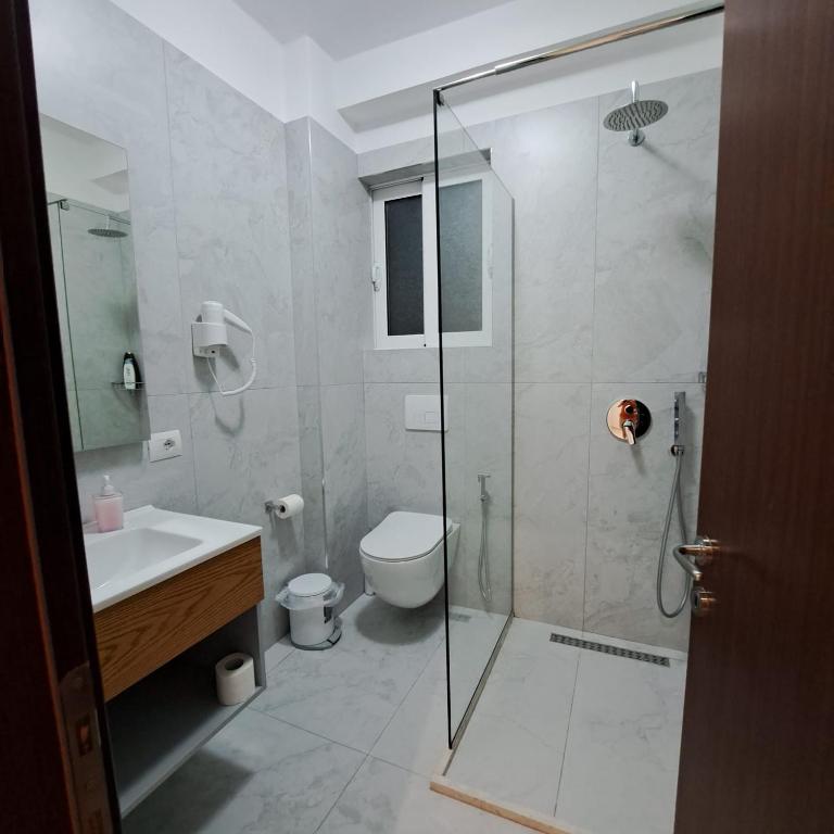 Koupelna v ubytování Apart-Hotel Alvi