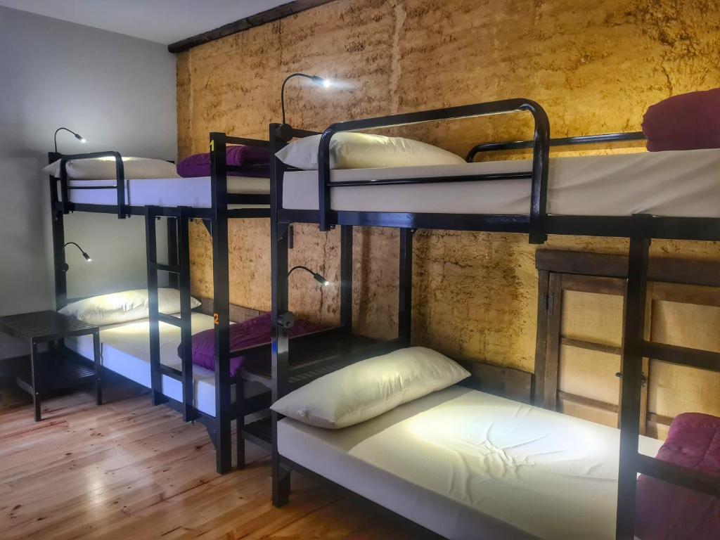 Postel nebo postele na pokoji v ubytování Albergue El Encanto