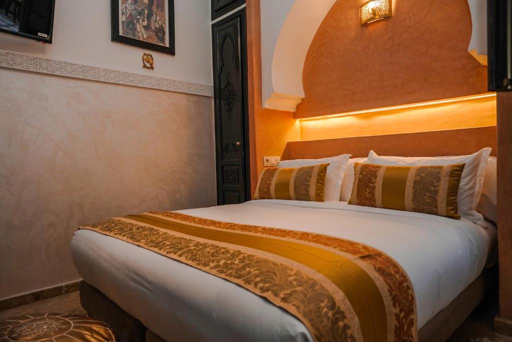 Postel nebo postele na pokoji v ubytování Riad Roummana Marrakech