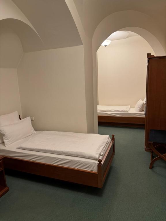 Postel nebo postele na pokoji v ubytování Das Wolfsbrunn