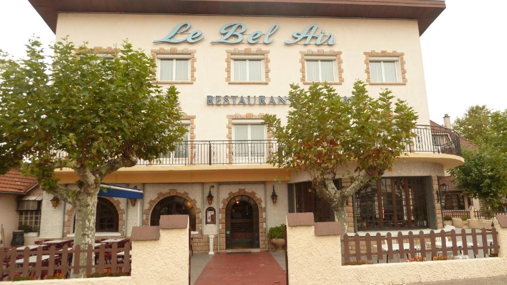 a building with a sign that reads be bed inn at Le Bel Air in Mions