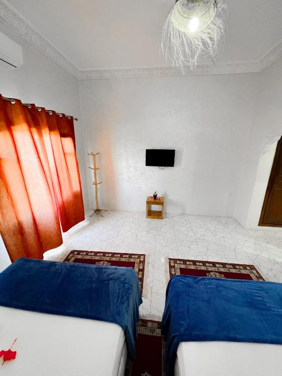 Ein Bett oder Betten in einem Zimmer der Unterkunft Guest House Qodwa