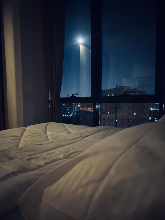 Postel nebo postele na pokoji v ubytování Deluxe Apartment