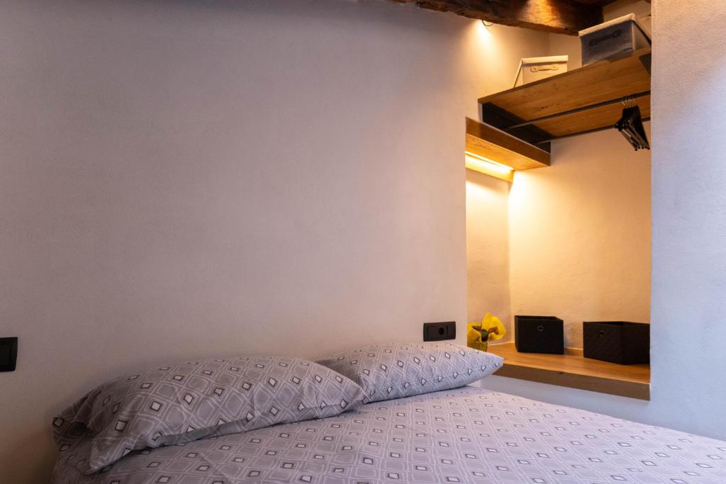 Postel nebo postele na pokoji v ubytování Niu de Queralt