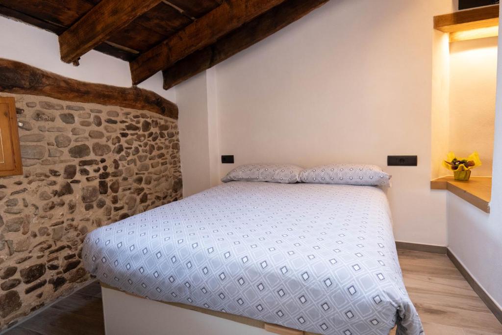 Postel nebo postele na pokoji v ubytování Niu de Queralt