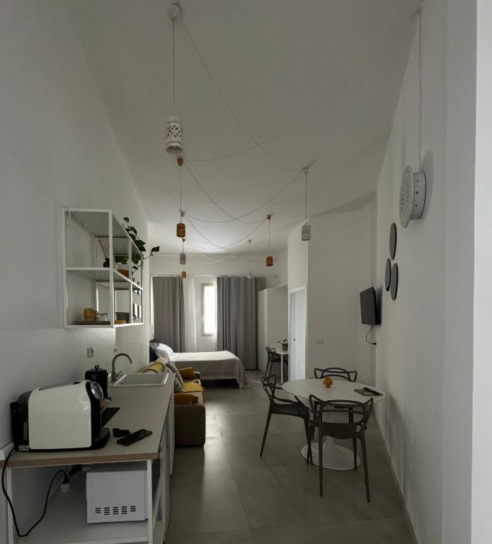Postel nebo postele na pokoji v ubytování Zefiro Suites