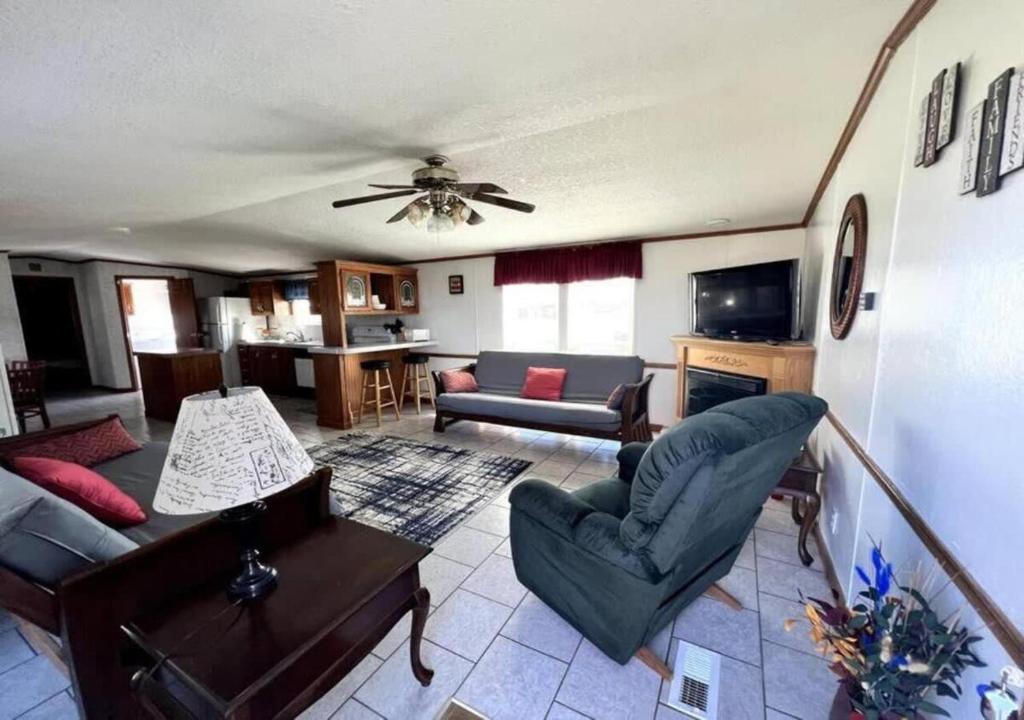 a living room with a couch and a table at Big Model Home in Bloomington in Bloomington