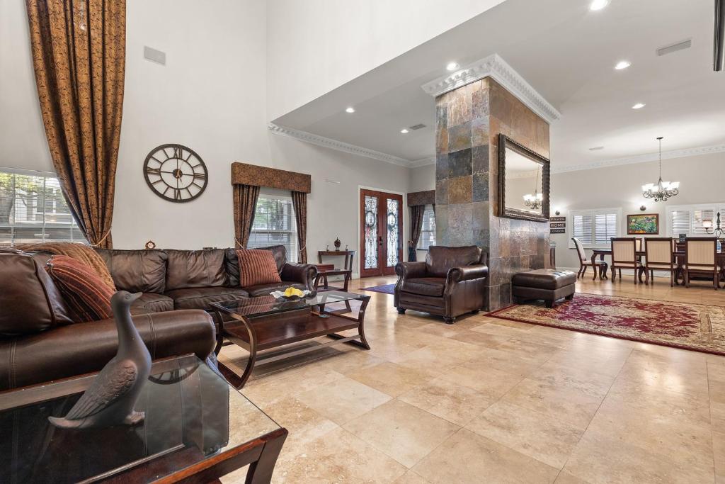 a living room with a couch and a table at Luxury Mason Villa Tampa Bay in Tampa