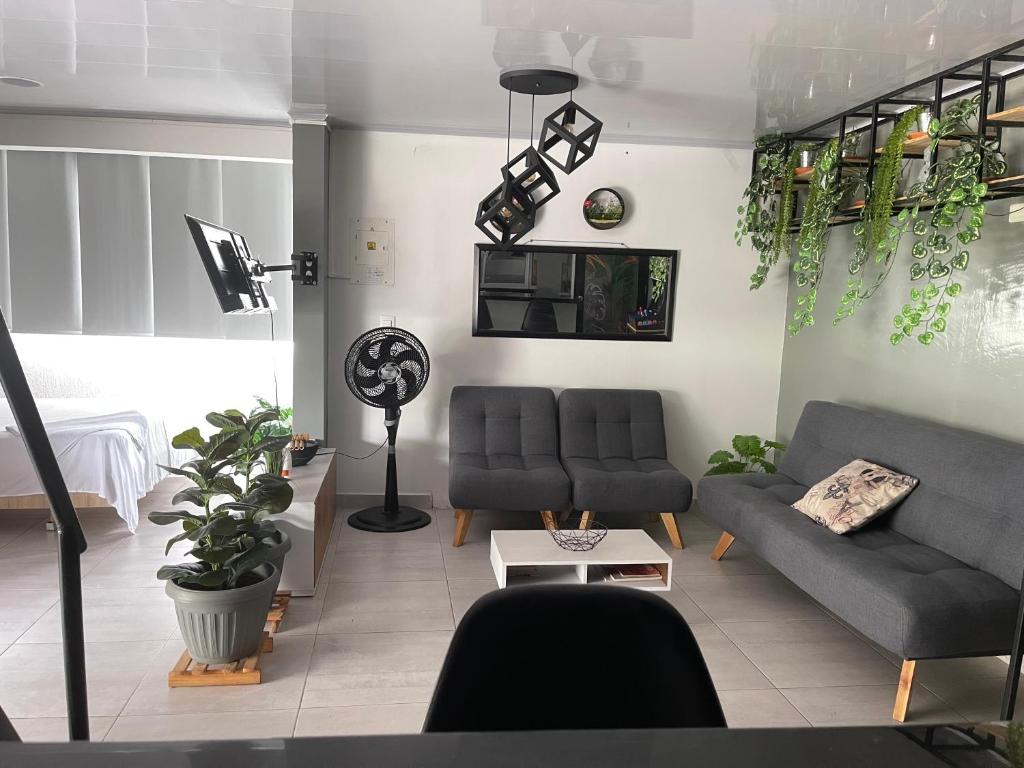 Posezení v ubytování Apartamento loft privado con terraza