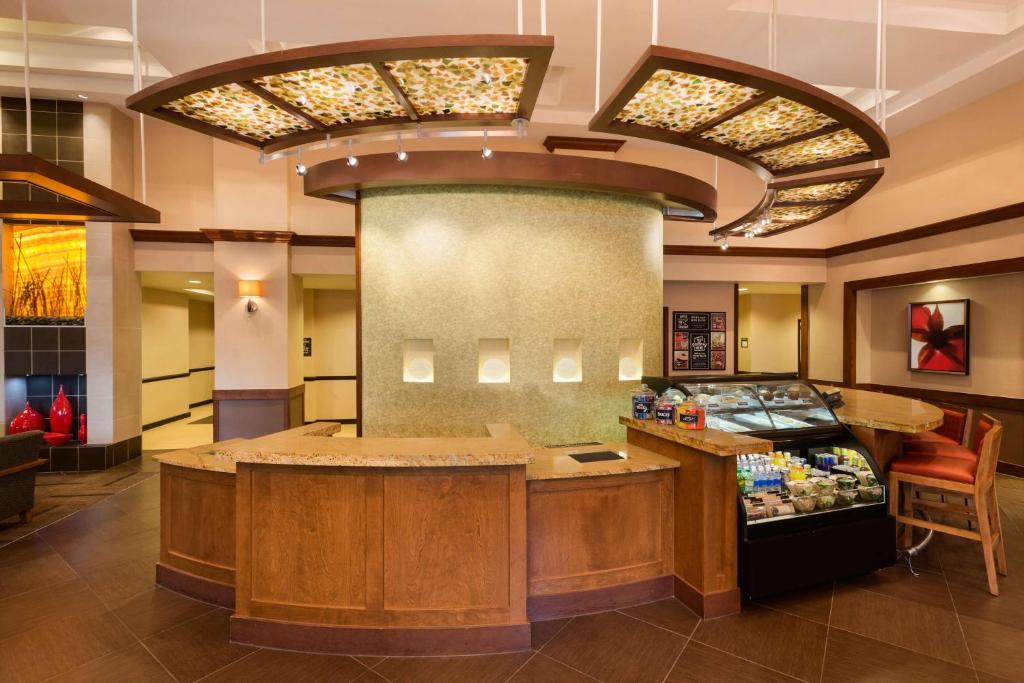 a lobby with a counter in a store at Hyatt Place Sterling Dulles Airport North in Sterling