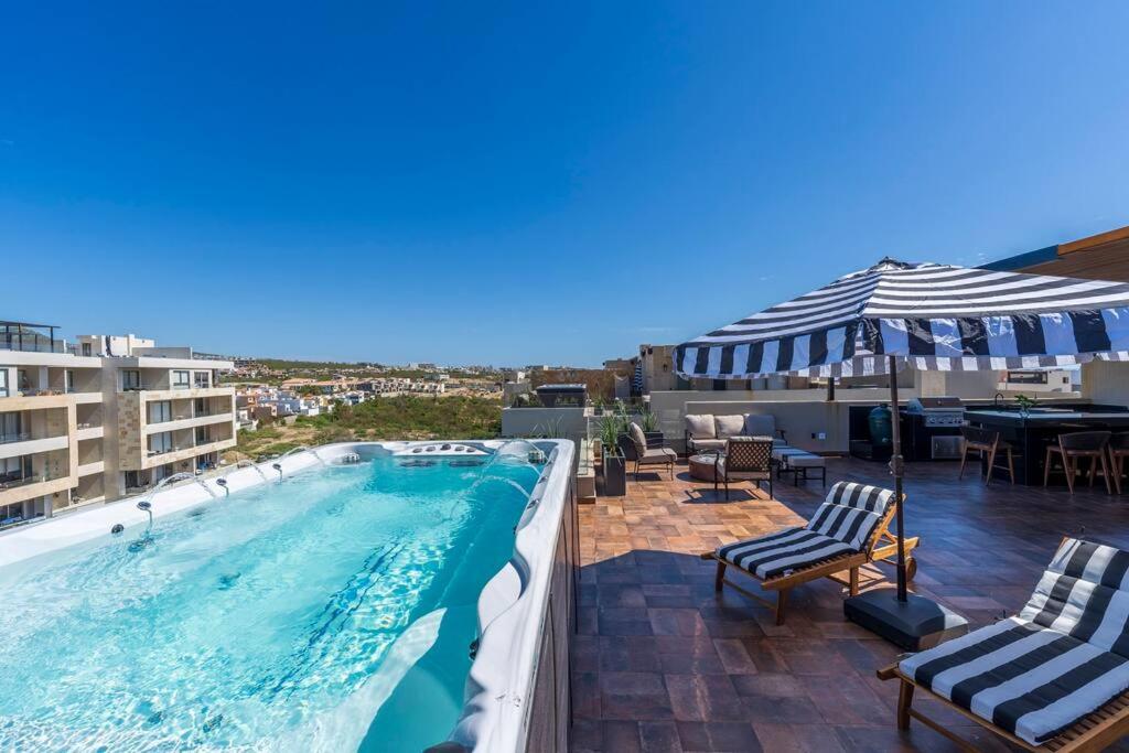 a swimming pool on the roof of a building at New Luxury PH 4BR Cabo in Cabo San Lucas