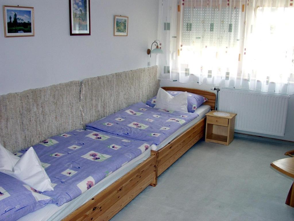 Postel nebo postele na pokoji v ubytování Lukács Ház