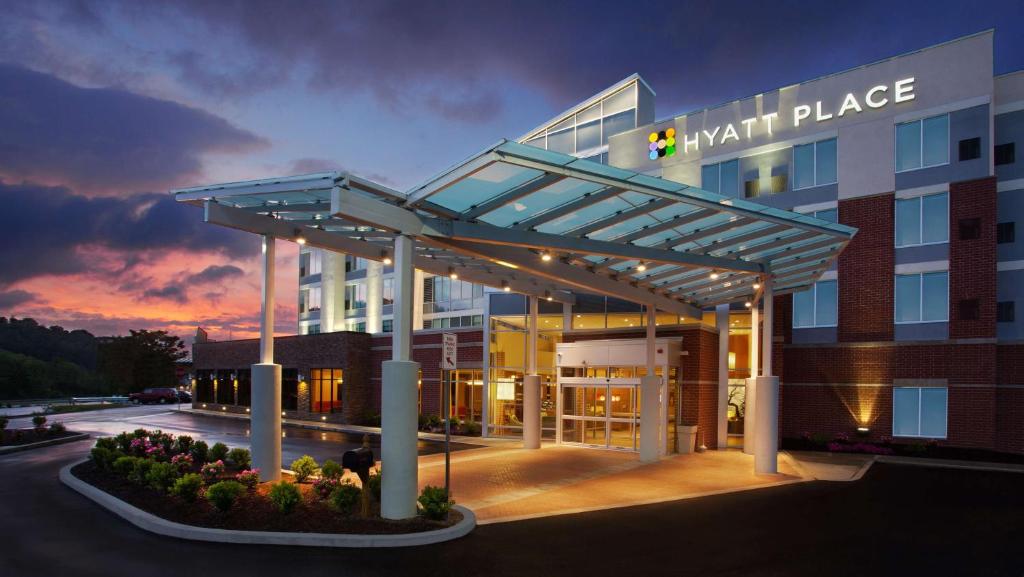 a large building with a sign on top of it at Hyatt Place at The Hollywood Casino Pittsburgh South in Washington