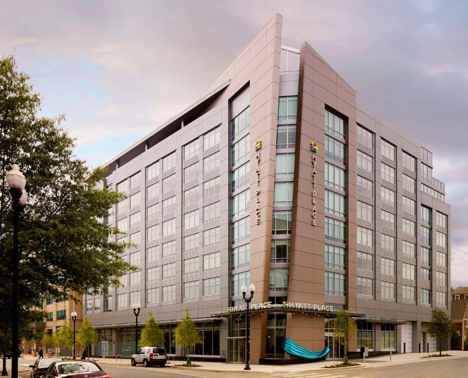 a rendering of a large office building at Hyatt Place Arlington Courthouse in Arlington