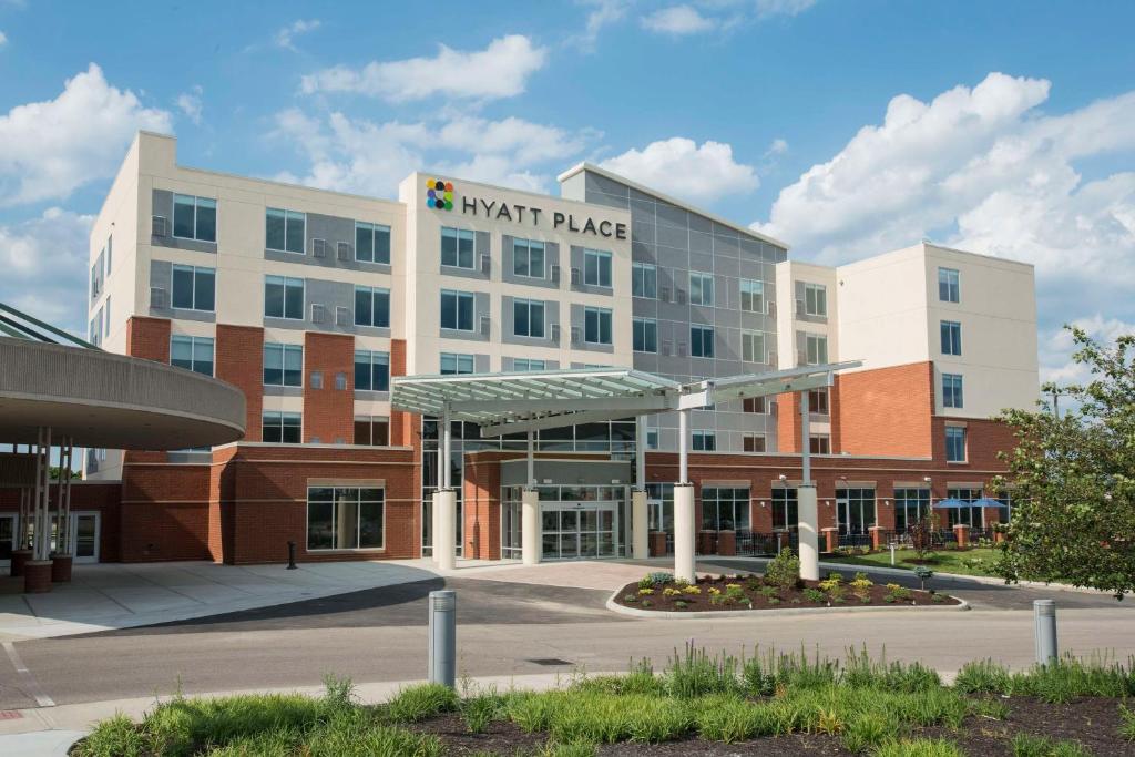 a large building with a math palace sign on it at Hyatt Place Cincinnati/Sharonville Convention Center in Sharonville