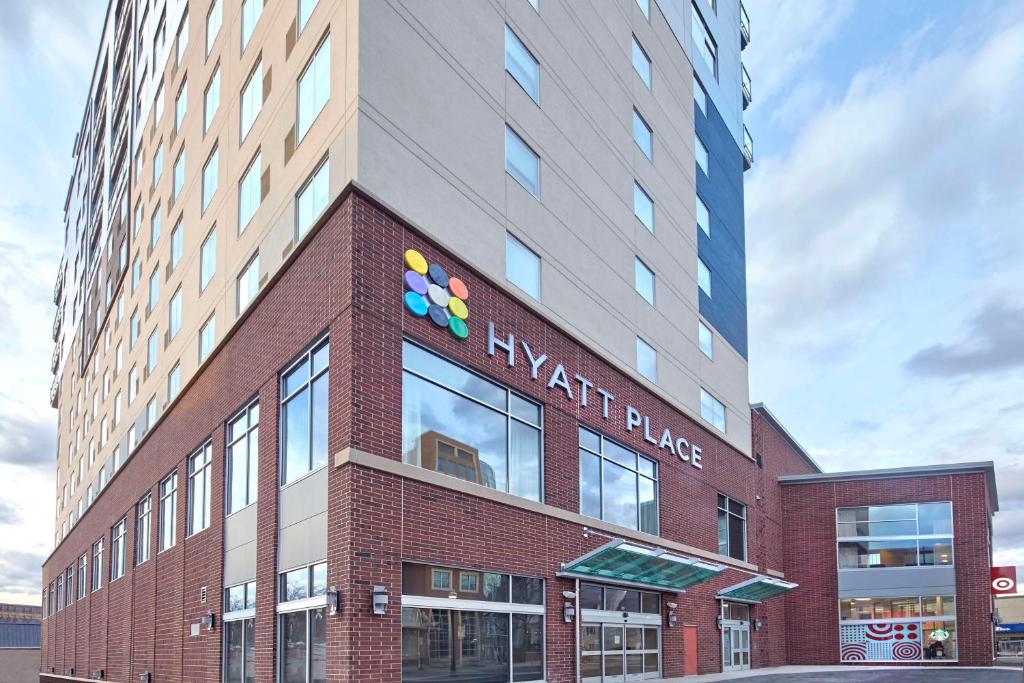 a building with a sign on the side of it at Hyatt Place State College in State College