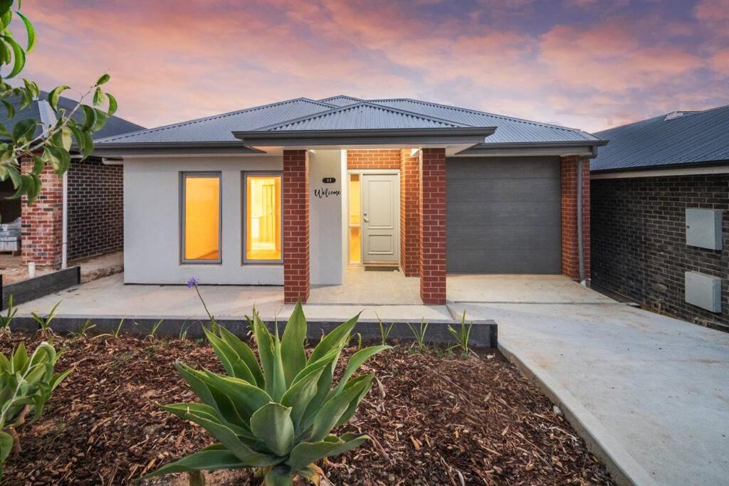 a brick house with a garage at Mt Baker Home:10km to Hahndorf in Mount Barker
