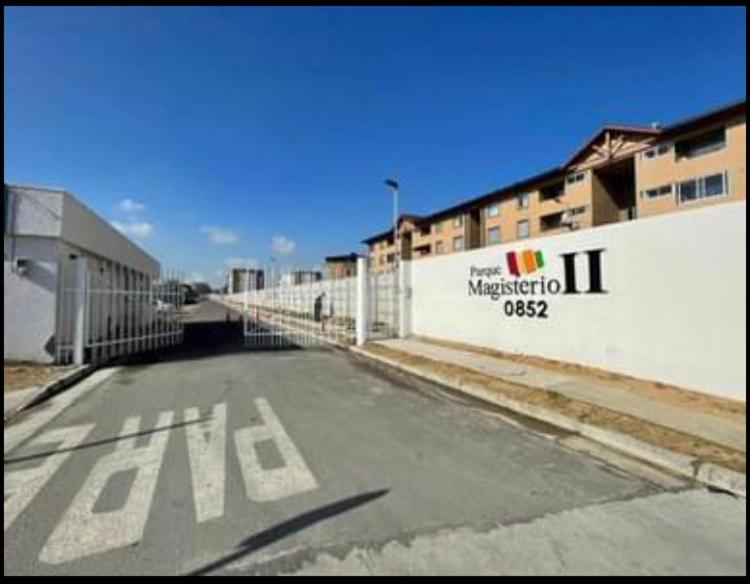 an empty parking lot in front of a building at Acogedor departamento en condominio in Talca