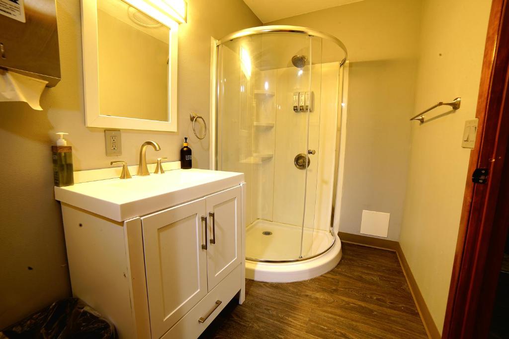 a bathroom with a shower and a sink and a toilet at Simple Deluxe Private Room in Anchorage