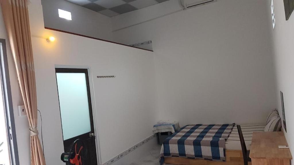 Postel nebo postele na pokoji v ubytování Hoa Lan Motel & Homestay