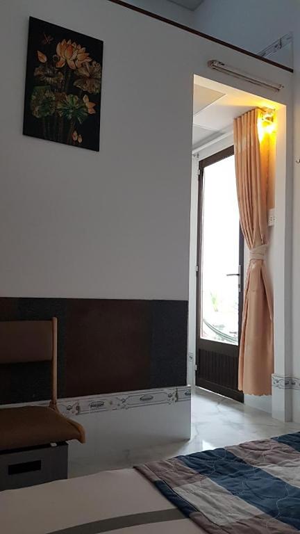Postel nebo postele na pokoji v ubytování Hoa Lan Motel & Homestay