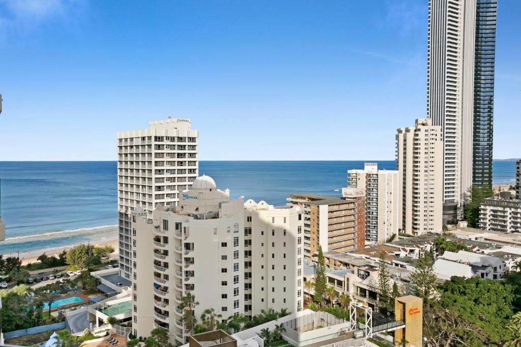 a view of a city with tall buildings and the ocean at Cosy 2-Bed Central Studio Apartment With Views in Gold Coast