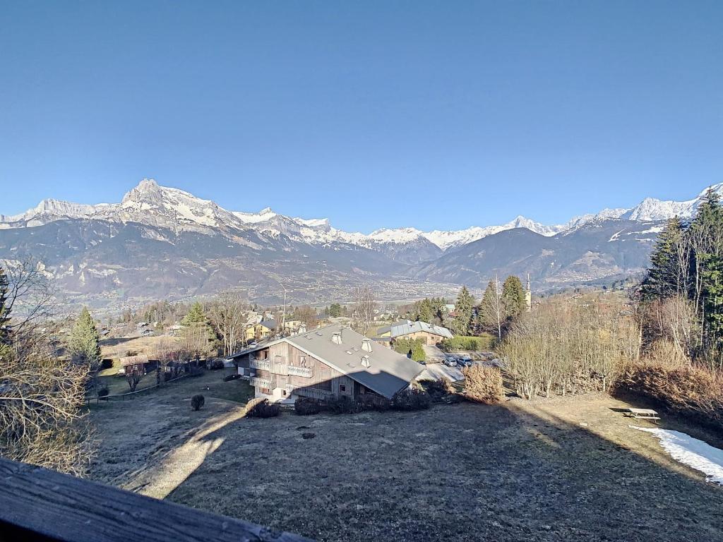 an aerial view of a house with mountains in the background at Appartement Combloux, 3 pièces, 5 personnes - FR-1-560-120 in Combloux