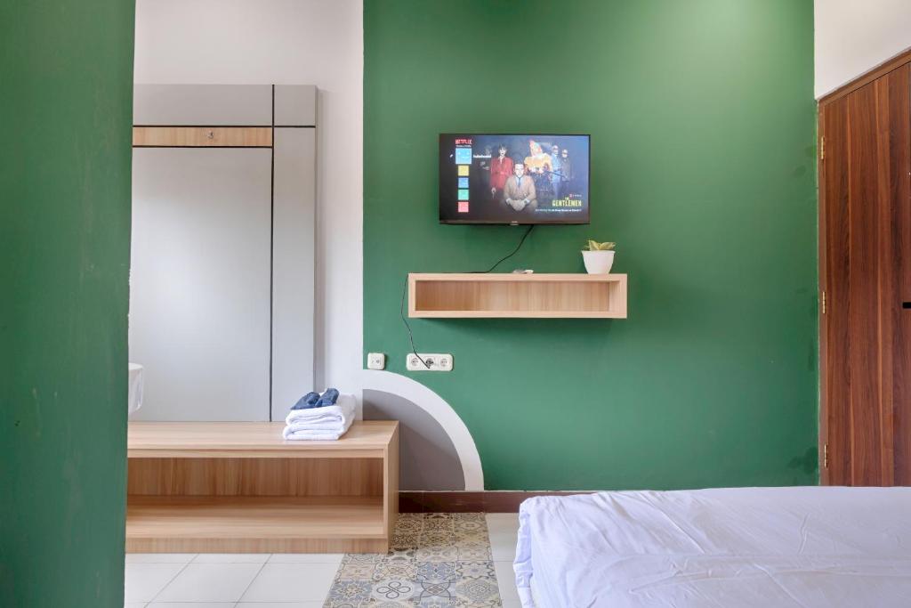 Postel nebo postele na pokoji v ubytování HUBS Hostel Yogyakarta