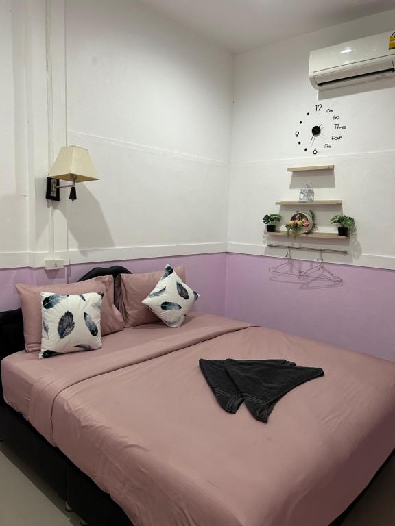 Postel nebo postele na pokoji v ubytování Labella samet guesthouse