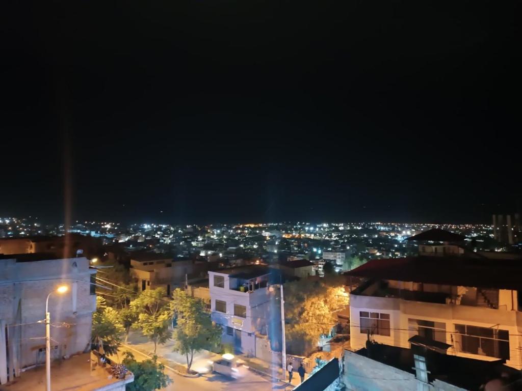 a view of a city at night with lights at Casa Hotel Místico in Ayacucho