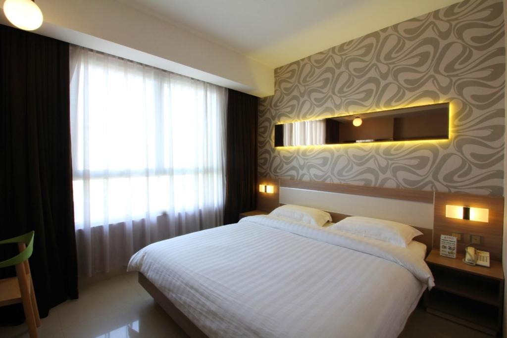 Postel nebo postele na pokoji v ubytování Classie Hotel