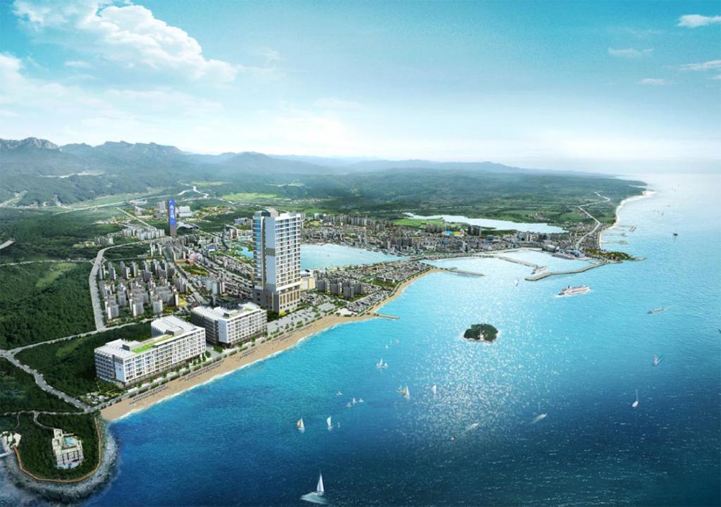 an aerial view of a city next to the water at Sokcho Chonpines Beach Hotel in Sokcho