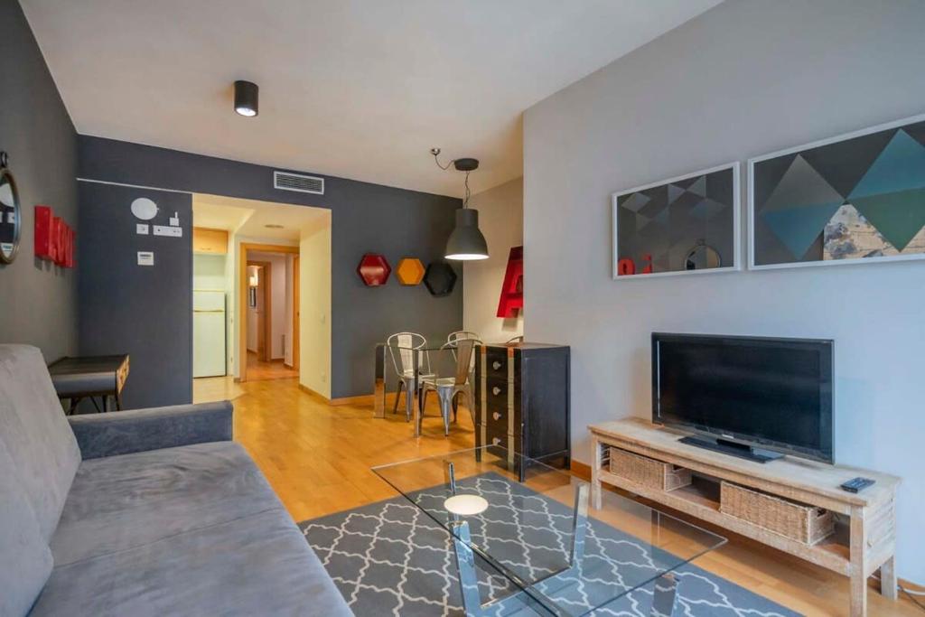 Televízia a/alebo spoločenská miestnosť v ubytovaní Modern and bright apartment in Eixample 5-2