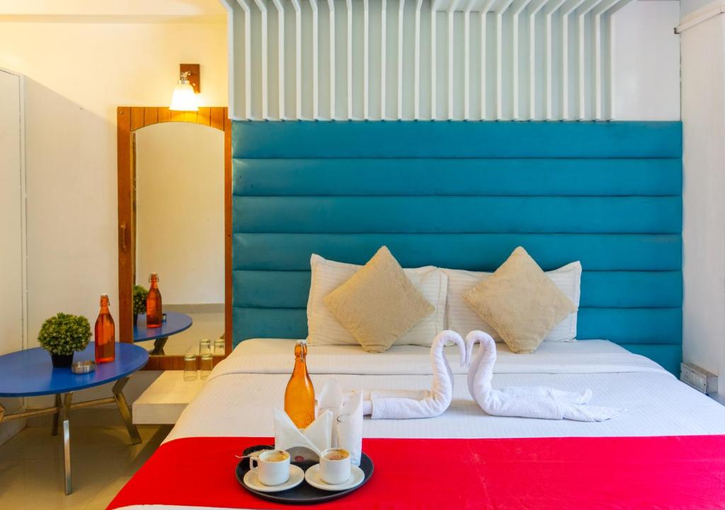 Postel nebo postele na pokoji v ubytování Hotel Majestic Grand