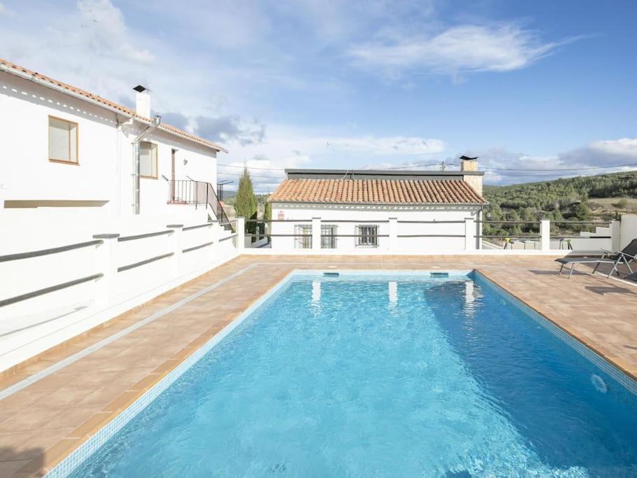 a swimming pool in the backyard of a house at Ca La Carmina in Pontons