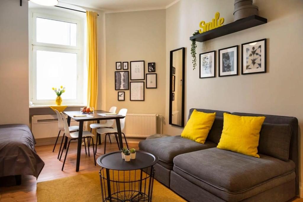 a living room with a couch and a table at Lovely Apartment in the near of Kudamm in Berlin