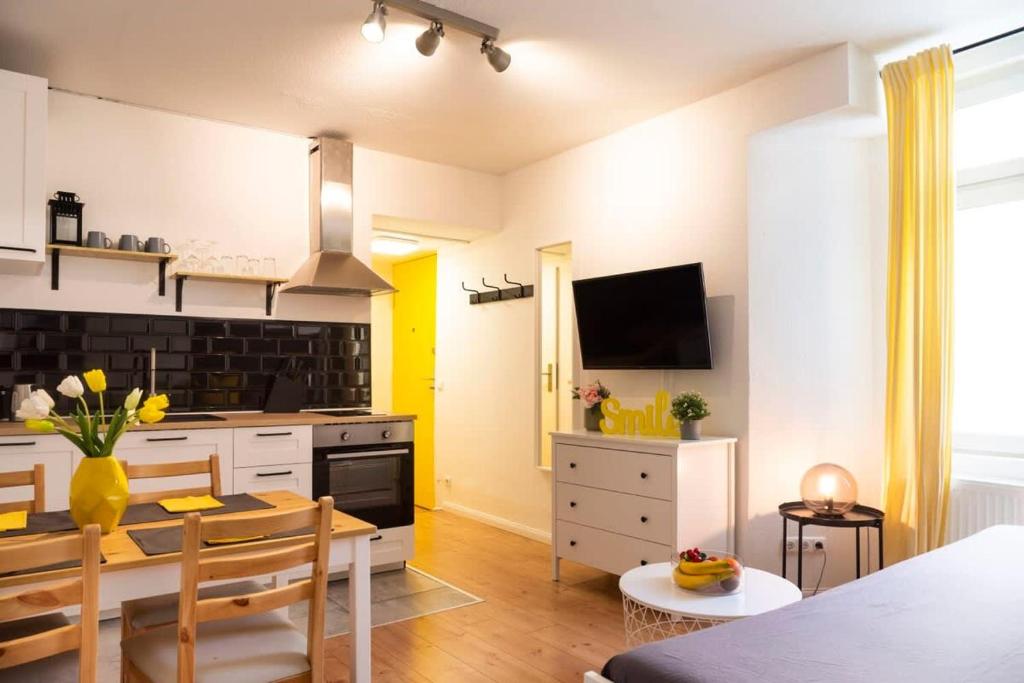 a kitchen with a table and a dining room at 2 Bedroom in great location in Kreuzberg in Berlin