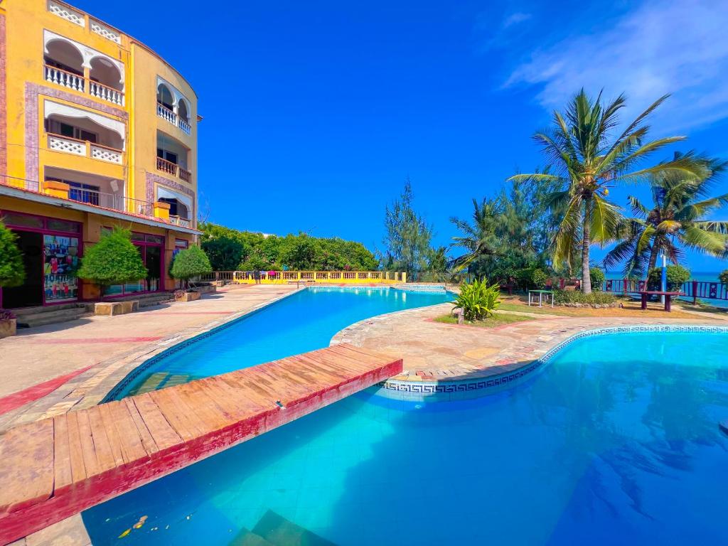 The swimming pool at or close to Raha Beachfront Apartment Mombasa shanzu with beautiful sea view