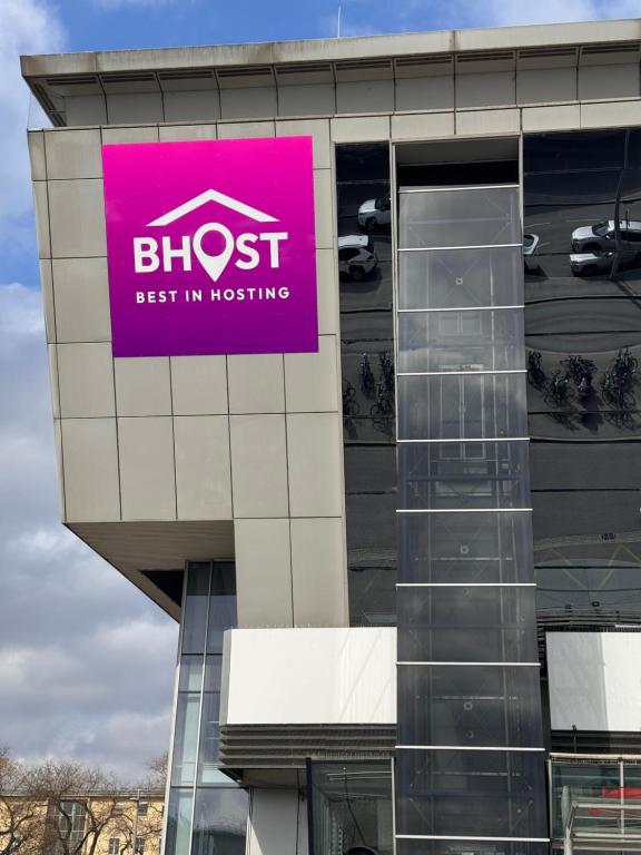 a pink sign on the side of a building at BEST IN HOSTING Graz in Graz