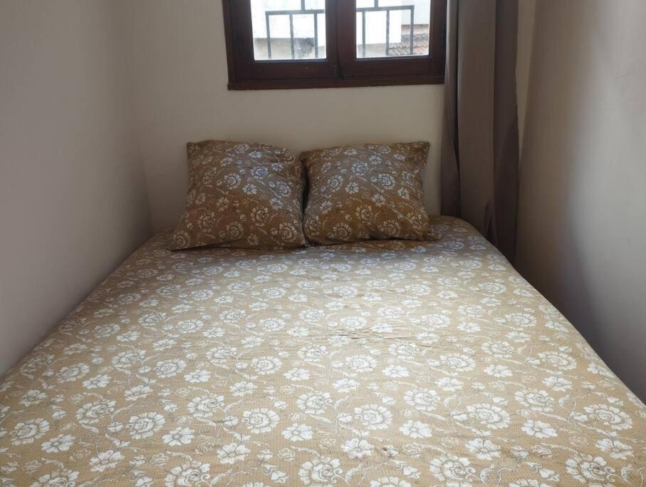 Postel nebo postele na pokoji v ubytování Appartement en plein centre.