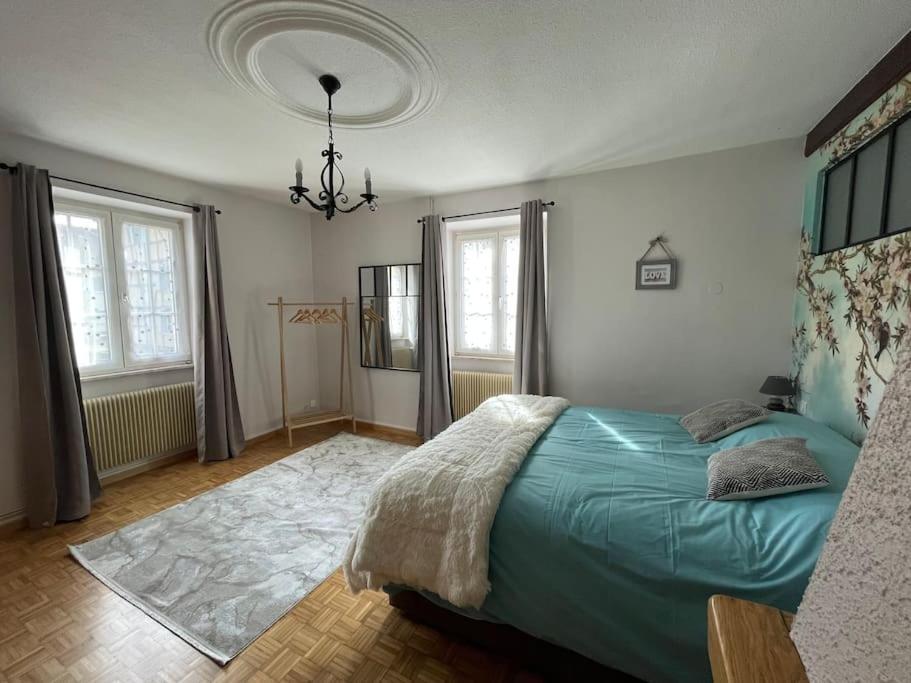 Postel nebo postele na pokoji v ubytování Gîte cosy pour 2 à 4 personnes, village proche Mulhouse
