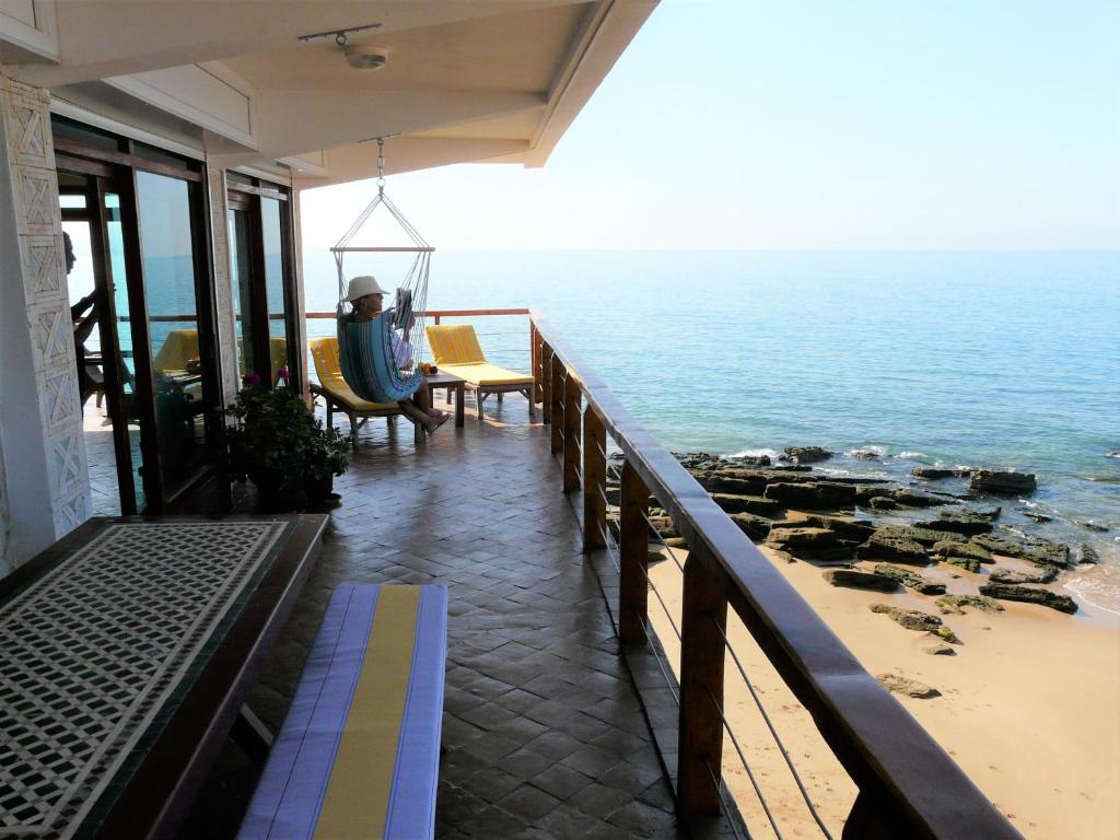a view of the ocean from a balcony of a house at taghazout playa in Taghazout
