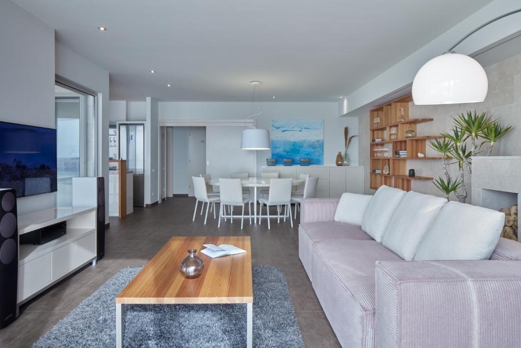 a living room with a couch and a table at Villa Roca in Vis