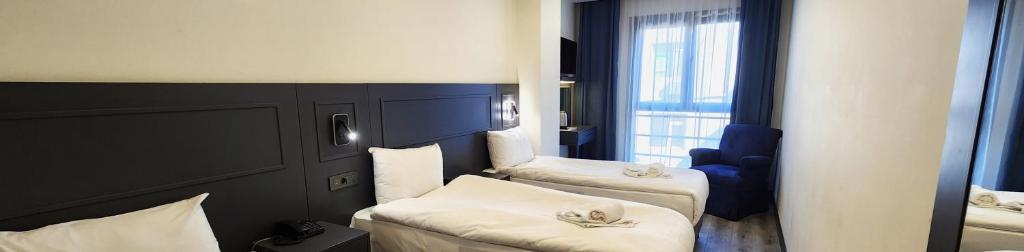 Postel nebo postele na pokoji v ubytování Shishly Palace Hotel