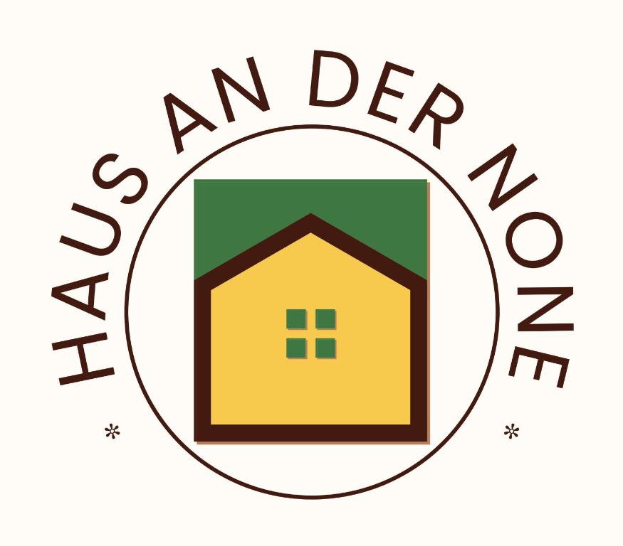 a logo for an agency with a house in the middle at Haus An der None in Herford
