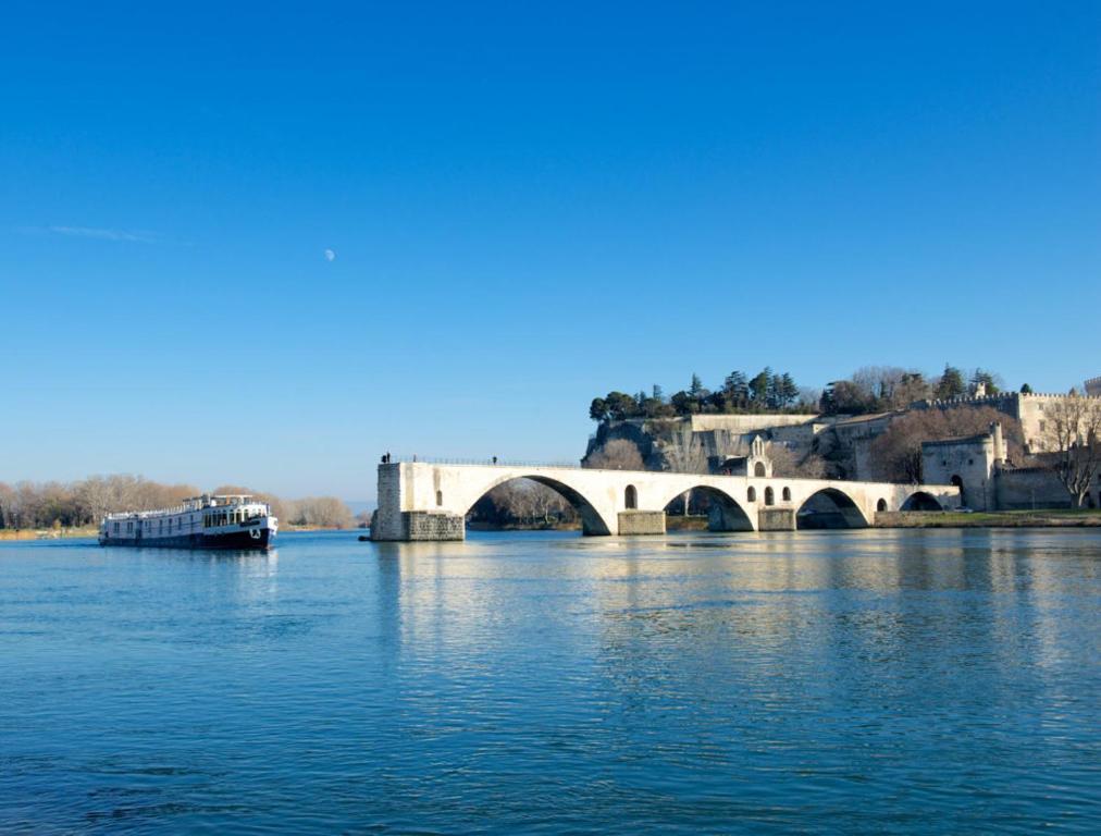 a bridge over a large body of water at Bateau Hotel à quai Le Chardonnay in Avignon